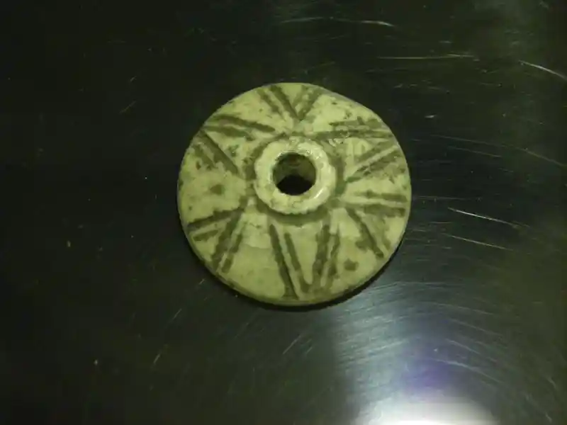 Six-pointed cross engraved on a disc ceremonial object in Syria